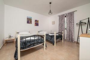 A bed or beds in a room at traditional suburbs maisonette