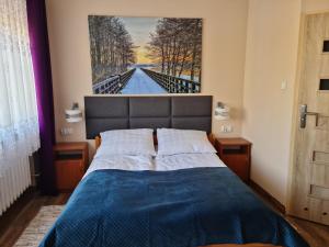 Postel nebo postele na pokoji v ubytování Pokoje Gościnne Ster