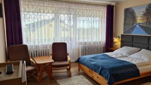 Postel nebo postele na pokoji v ubytování Pokoje Gościnne Ster