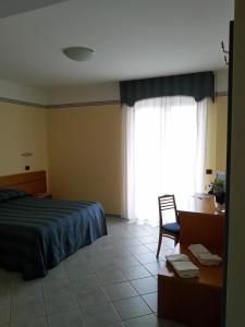 Postel nebo postele na pokoji v ubytování Hotel Pegaso