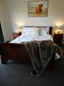 Säng eller sängar i ett rum på Hilltop Haven