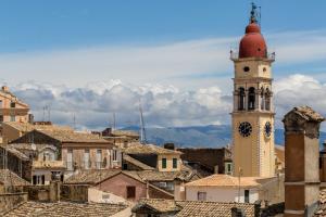 a clock tower in the middle of a city at Artist Loft in Corfu
