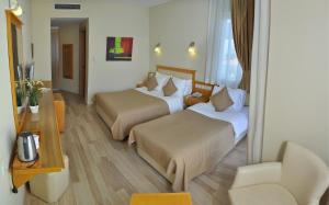 Postel nebo postele na pokoji v ubytování Hotel Doruk