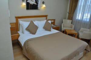 Postel nebo postele na pokoji v ubytování Hotel Doruk