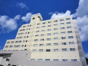 a large white building with a sky in the background at Angel Resort Yuzawa - Vacation STAY 10547 in Yuzawa