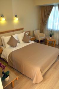 Postel nebo postele na pokoji v ubytování Hotel Doruk