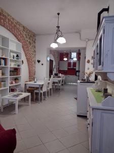 a kitchen and dining room with a table and chairs at L'incanto di Maja in Pacentro