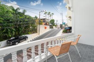 a balcony with a view of a street at 2BR Homey townhome 350M walk to Kata Beach Fully equipped in Kata Beach