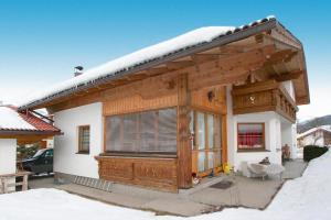 a small house with a snow covered roof at holiday home, Axams in Innsbruck