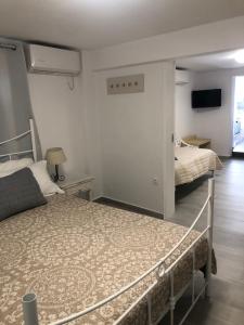 Voodi või voodid majutusasutuse Afrodete Hotel toas