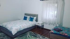 A bed or beds in a room at Casa de vacanta Sabrina
