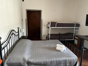 a bedroom with a bed with two bunk beds at Casa di Maria in Diamante