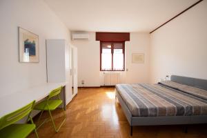 a bedroom with a bed and a desk at ABC Holiday in Salò +52 photos