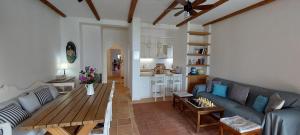 a living room with a couch and a table at Gatzea's laurel house in Kato Gatzea
