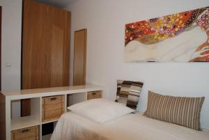 En eller flere senge i et værelse på Precioso apartamento junto a la ría