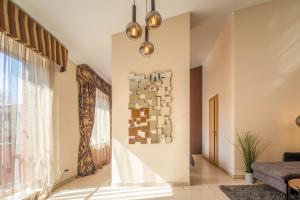 a living room with a painting on the wall at Šimkaus Abstrakcija in Klaipėda