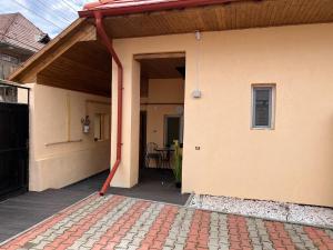 an outside view of a house with a patio at Green Home in Miercurea-Ciuc