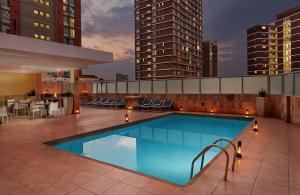 a swimming pool on the roof of a building at The Oceanic 1 bedroom with Ocean views - Self-catering Apartment in Durban