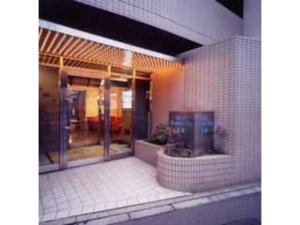 a building with a tv on the side of it at Hotel Business Villa Omori - Vacation STAY 08200v in Tokyo