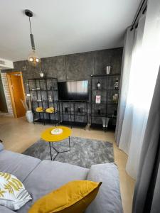 a living room with a couch and a table at Spirit of Mar Menor in Torre-Pacheco