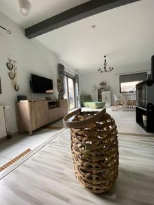 a living room with a large vase on the floor at La Maison de Mel in Bois le Duc