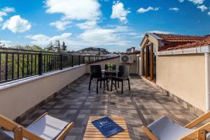 a balcony with a table and chairs on a building at Baymari Suites Design Florya in Istanbul