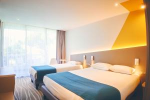 Кровать или кровати в номере Hotel Le Quetzal