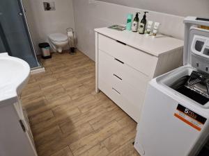 a kitchen with a sink and a counter with a stove at Wypoczynek w górach in Węgierska Górka