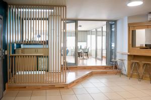 a living room with a kitchen and a dining room at Urban Downtown Suite - Meno Homes 4 in Xanthi