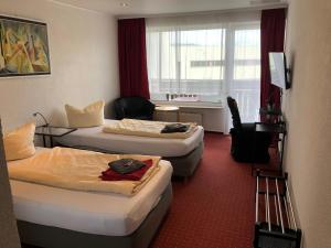 Posezení v ubytování Hotel Saarland Lebach