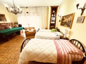 A bed or beds in a room at Affittacamere Umberto&Marisa