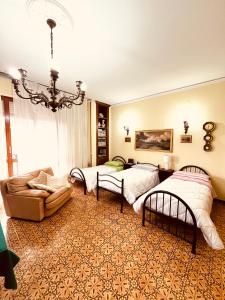 A bed or beds in a room at Affittacamere Umberto&Marisa