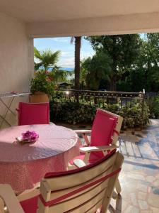 a table and chairs on a patio with a view at Apartment Tominovic in Opatija