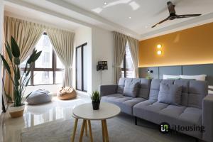 a living room with a couch and a table at Bali Residence Malacca Premium By I Housing in Malacca