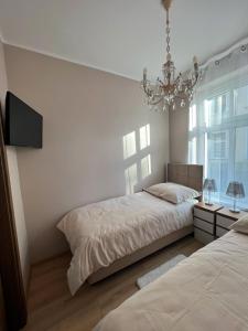 Ένα ή περισσότερα κρεβάτια σε δωμάτιο στο Apartament Olivia Business Suite