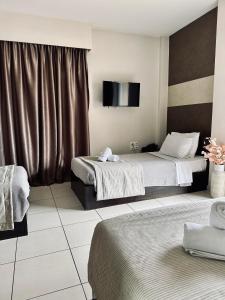 TV a/nebo společenská místnost v ubytování Mc Queen Rooms & Apartments