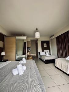 Postel nebo postele na pokoji v ubytování Mc Queen Rooms & Apartments