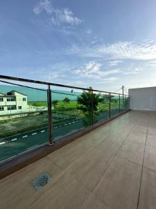 a large balcony with a view of a road at Cassa Vistana Homestay Alor - Langgar near HSB in Alor Setar