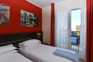 Posteľ alebo postele v izbe v ubytovaní Hotel Vienna