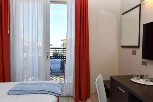 Posteľ alebo postele v izbe v ubytovaní Hotel Vienna