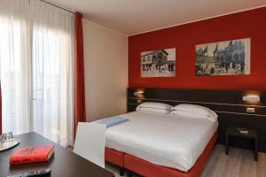 Posteľ alebo postele v izbe v ubytovaní Hotel Vienna
