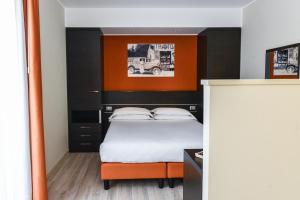 Posteľ alebo postele v izbe v ubytovaní Hotel Vienna