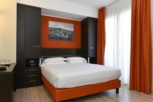 Posteľ alebo postele v izbe v ubytovaní Hotel Vienna