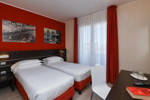 Posteľ alebo postele v izbe v ubytovaní Hotel Vienna