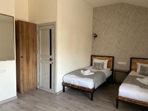 Voodi või voodid majutusasutuse WaterFall Hotel toas