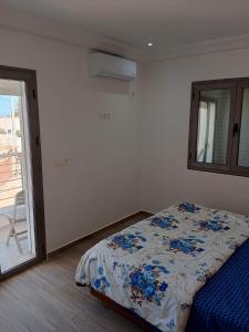 Voodi või voodid majutusasutuse Résidence Inès Djerba Appartement de Luxe toas