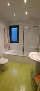 a bathroom with a shower and a toilet and a sink at Villa Panorámica in Sant Jordi