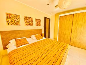 A bed or beds in a room at Panda Grey with balcony Hurghada center