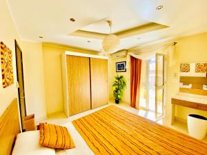 A bed or beds in a room at Panda Grey with balcony Hurghada center