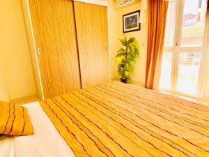 A bed or beds in a room at Panda Grey with balcony Hurghada center